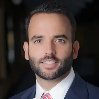 Dr. Joel Baez, DMD, DICOI, of Signature Dental Group.